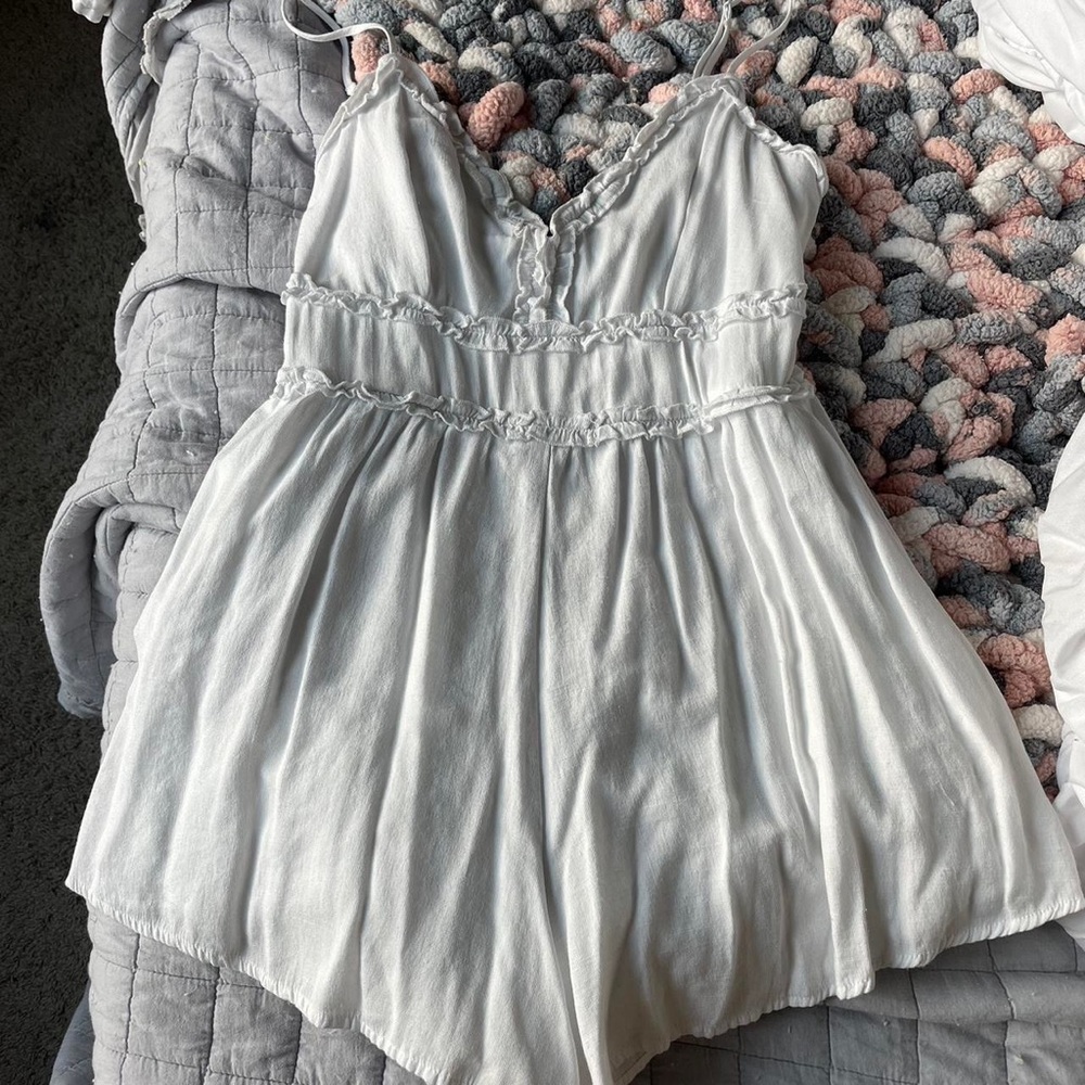 White romper from Francesca‘s
Only see through if your wear dark colors